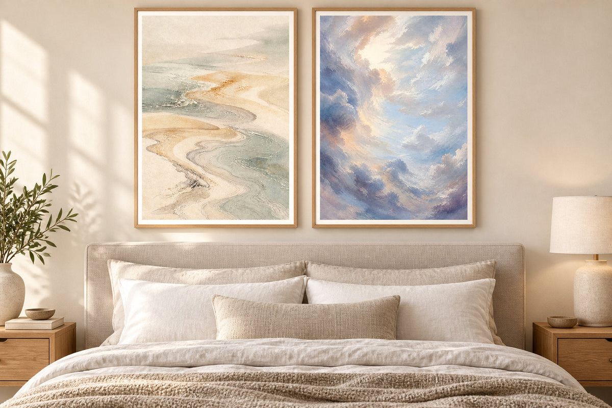 Two landscape posters in oak frames above a wooden bed.