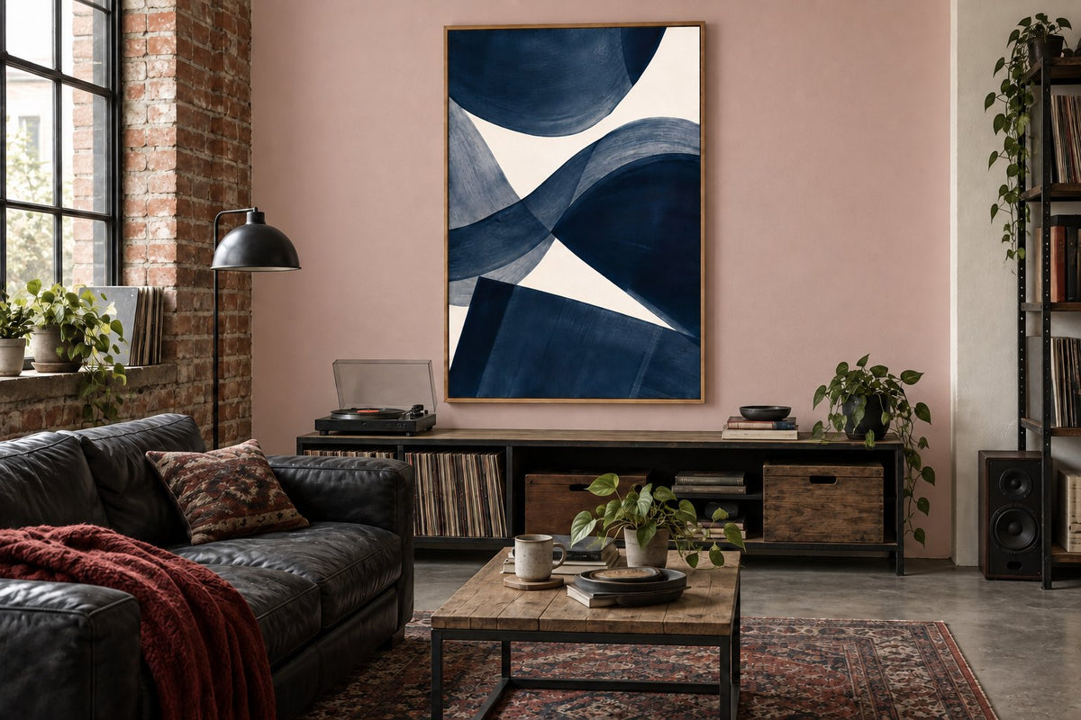 The same living room and abstract print against a pink wall